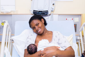 Mother in hospital bed with newborn